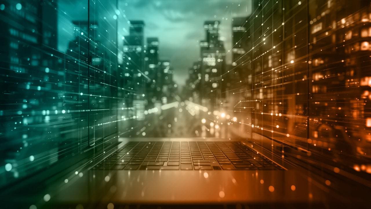 A computer screen with the city in the background.